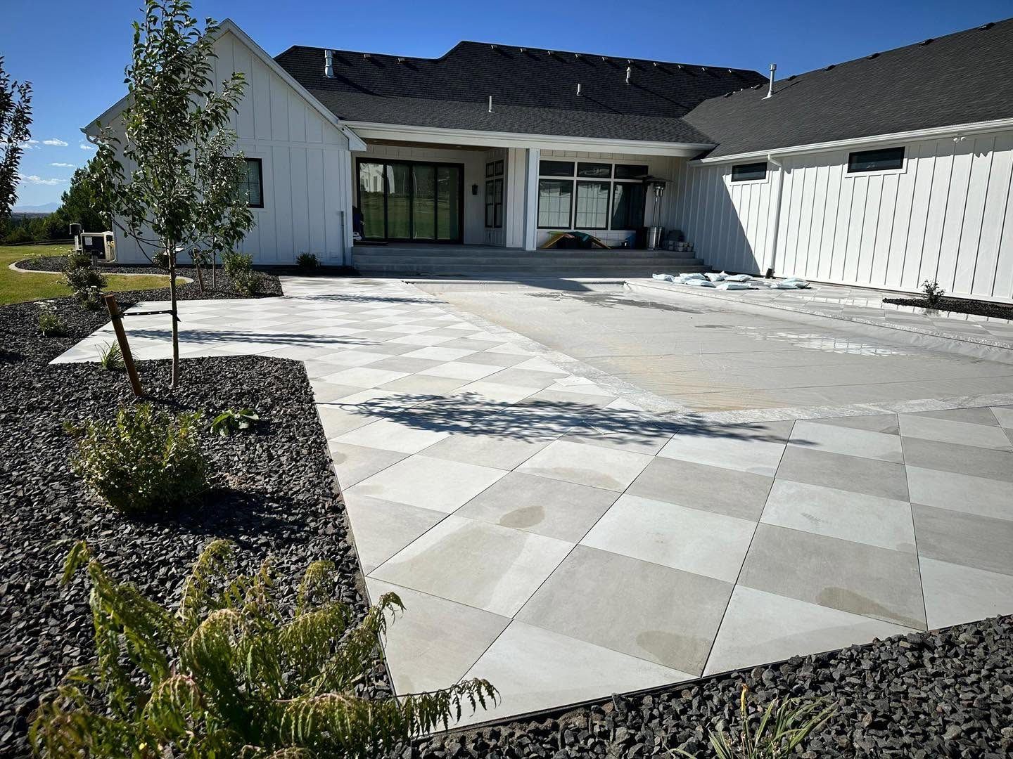 Large-format paver patio at a modern farmhouse in eastern Idaho